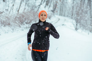 Woman running snow exercise outdoors